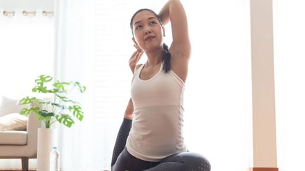Asian woman stretching her arms