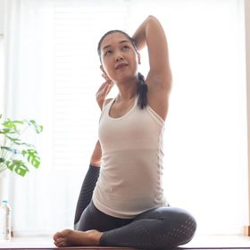 Asian woman stretching her arms