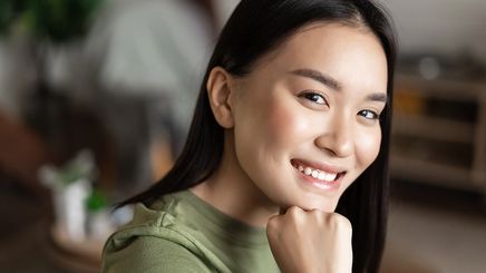 Smiling Asian woman with radiant skin