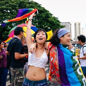 Lesbian couple celebrating pride march