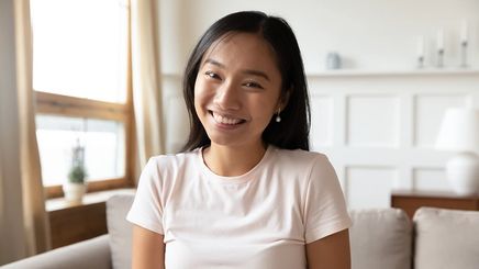 Asian millennial woman smiling