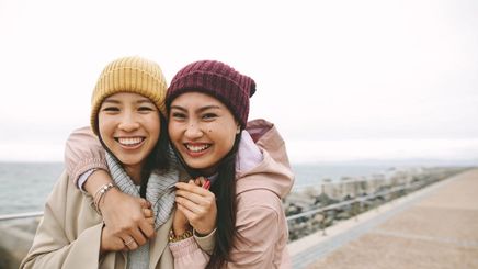 Two Filipino women traveling in cold weather clothes