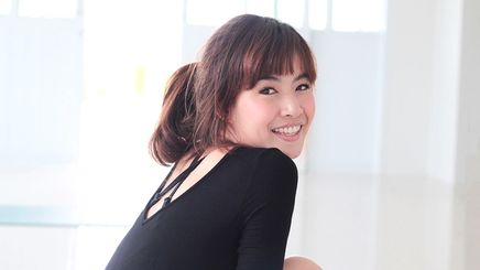 Asian woman with bangs smiling