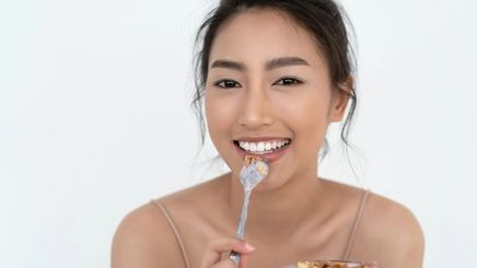 Asian woman eating 