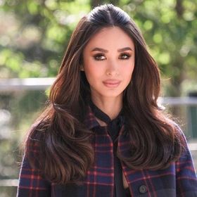 A portrait of Heart Evangelista with bumpit hair.