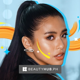 A portrait of Gabbi Garcia with glam makeup and faux freckles.