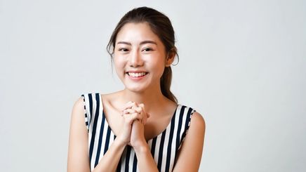 Asian woman with clean, glowing complexion