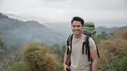 Asian man hiking