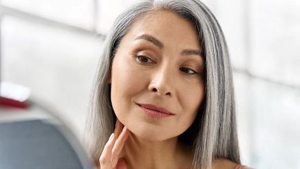 Middle-aged Asian woman smiling