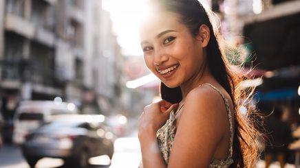 Asian woman on the street under the scorching sun