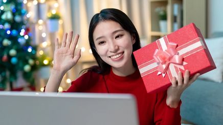 Asian woman holding a gift