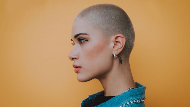 a beautiful woman with a buzz cut 