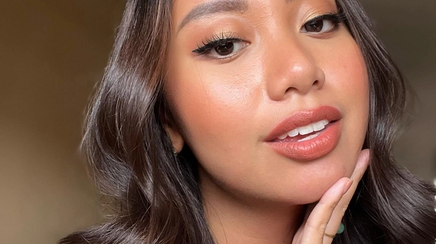 Ayn Bernos, Filipino woman, shows off lip color in a selfie.