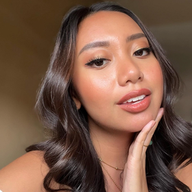 Ayn Bernos, Filipino woman, shows off lip color in a selfie.