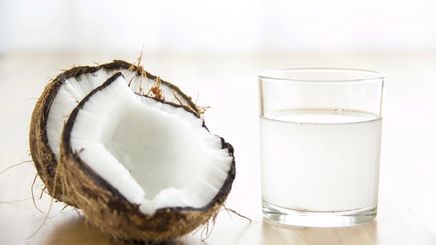 Coconut and coconut water in a glass  