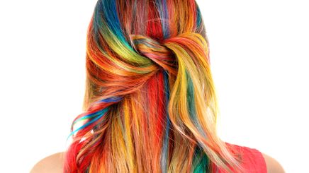 Back view of a woman with rainbow hair