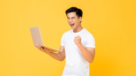 Man holding a laptop.