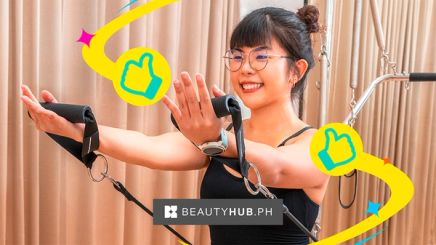 Young Asian woman on a Pilates reformer