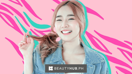 Happy Asian woman with chemically treated pink hair
