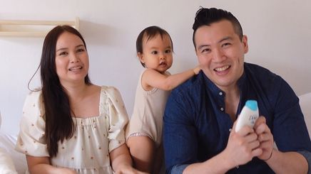 Happy Asian parents with baby