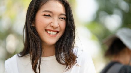 Asian woman happy and smiling