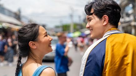 Asian man and woman looking lovingly at each other.