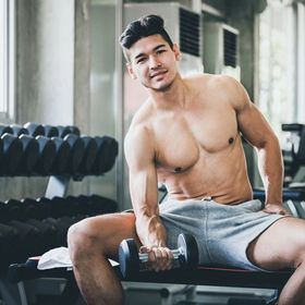 Handsome Asian man at gym 