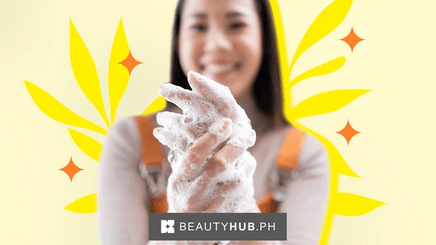 Asian woman washing her hands with soap