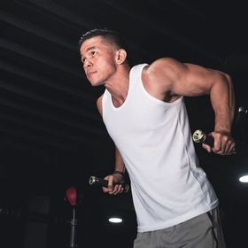 A man does triceps dips.