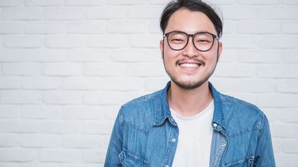 Happy Asian man wearing glasses 