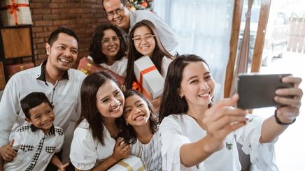 Filipino family taking a photo during a holiday. 