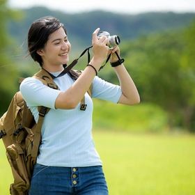 Young Asian woman holding a camera