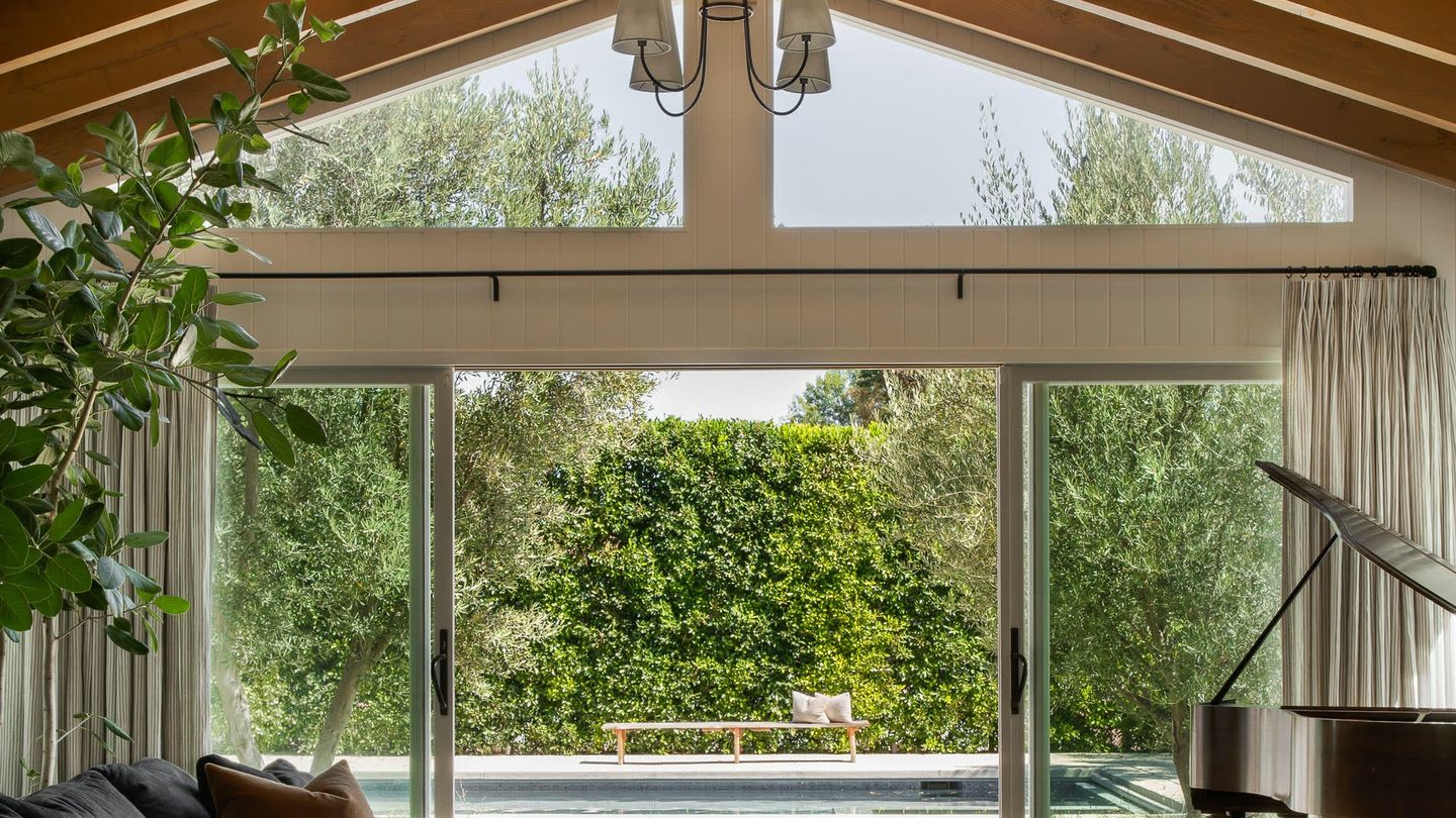 Handcrafted wrought iron curtain rods styled in a California home