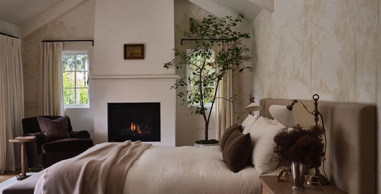 Elegant bedroom with custom iron curtain rod and drapery hardware