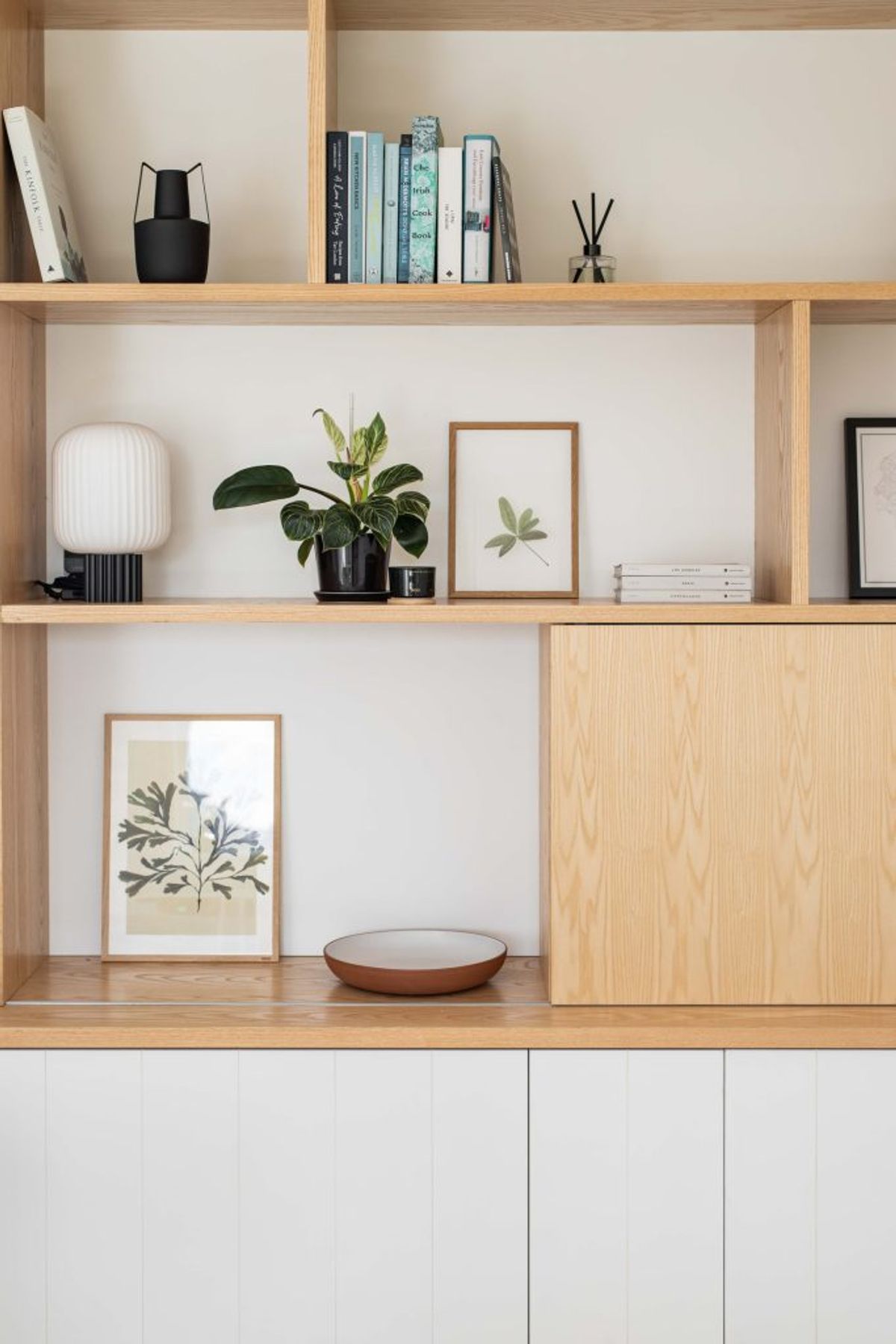 Interior Photography, shelf with photo frames, plants and books  | Elyse Kennedy | Meet Margo edit