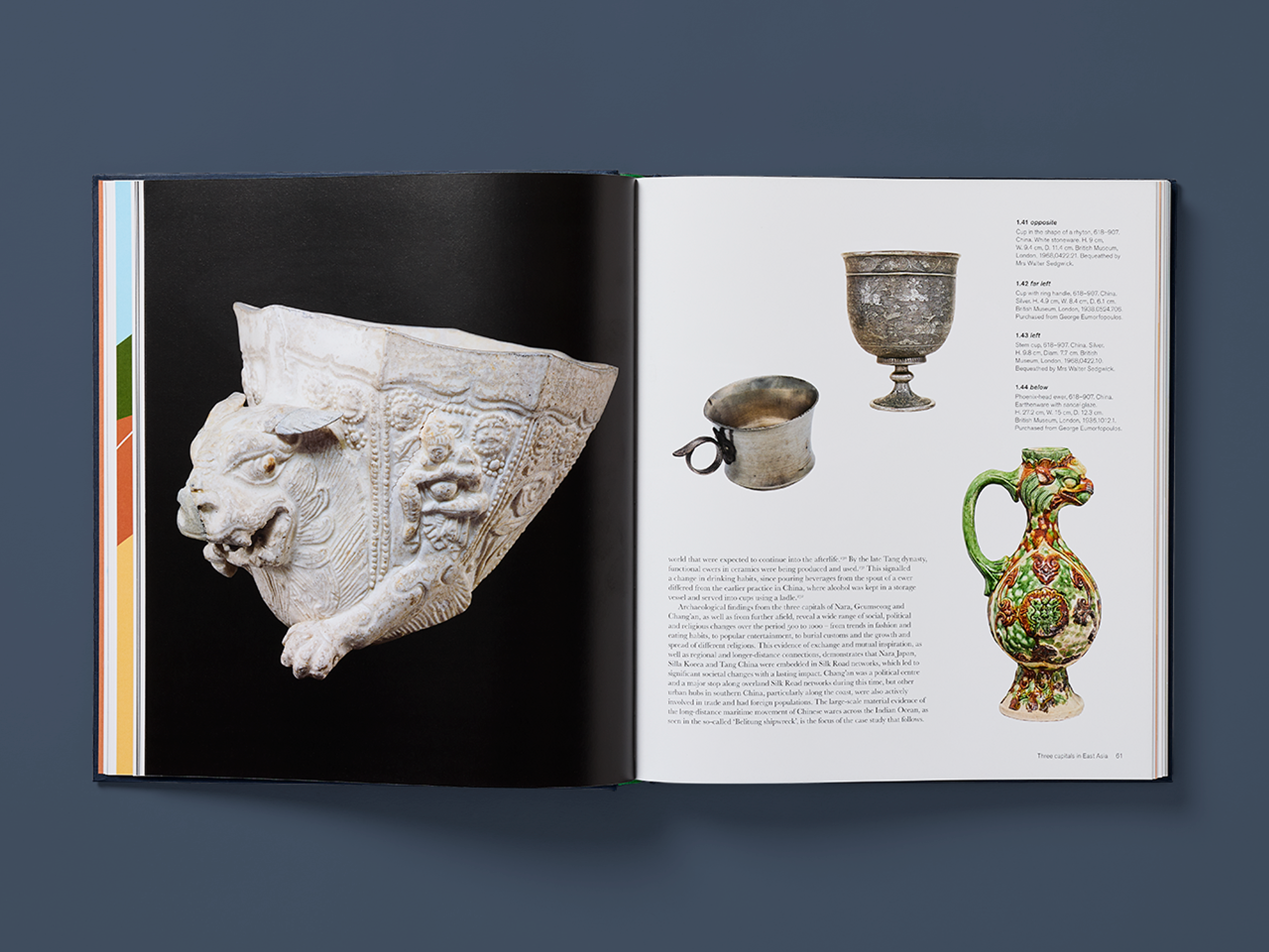 Open spreads from the Silk Roads showing photographs of various antique figurines accompanied by explanatory text.