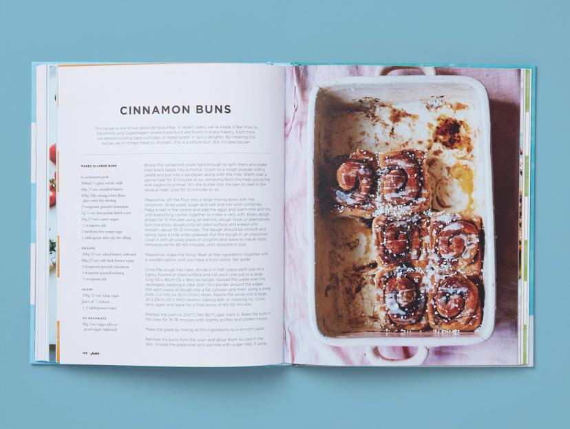 Open spread from Jude's Ice Cream and Desserts, featuring a recipe for cinnamon buns and its corresponding photo.