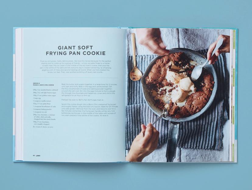 Open spread from Jude's Ice Cream and Desserts, featuring a recipe for a giant soft frying pan cookie and its corresponding photo.