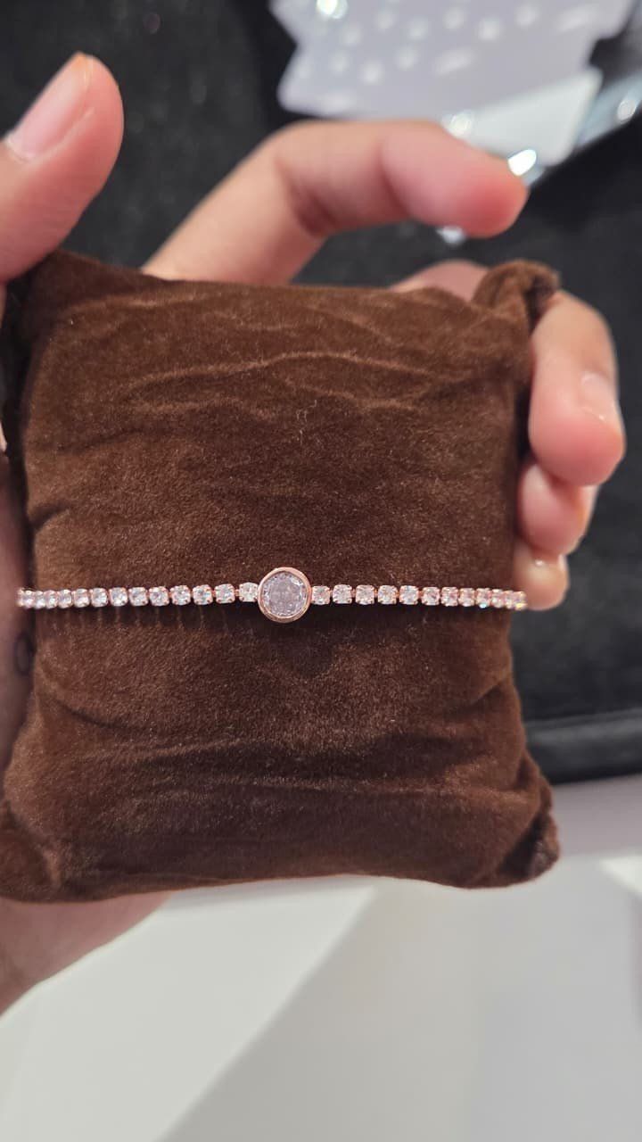 Rose gold tennis bracelet with round charm *