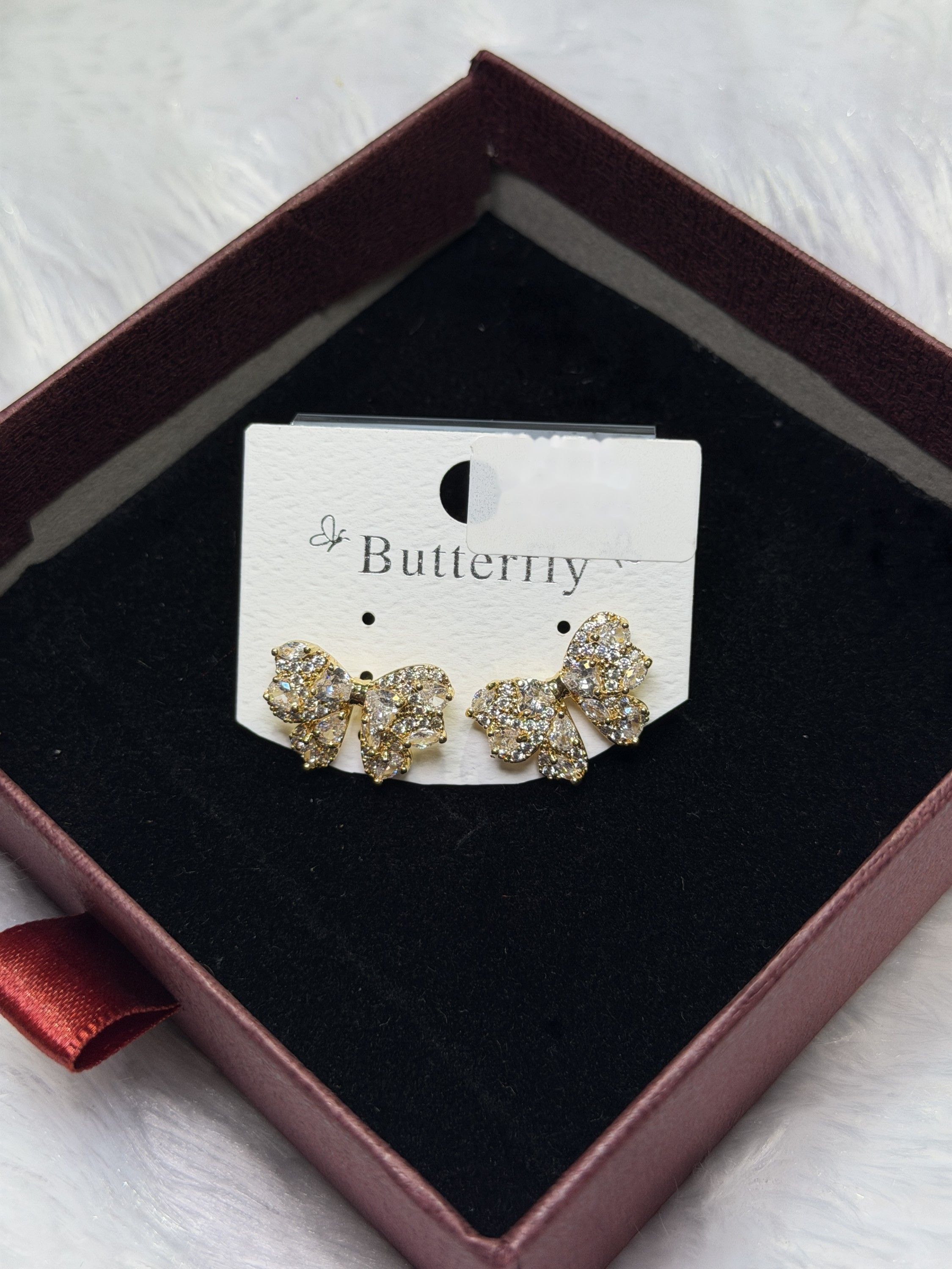 Bow stone stud earrings