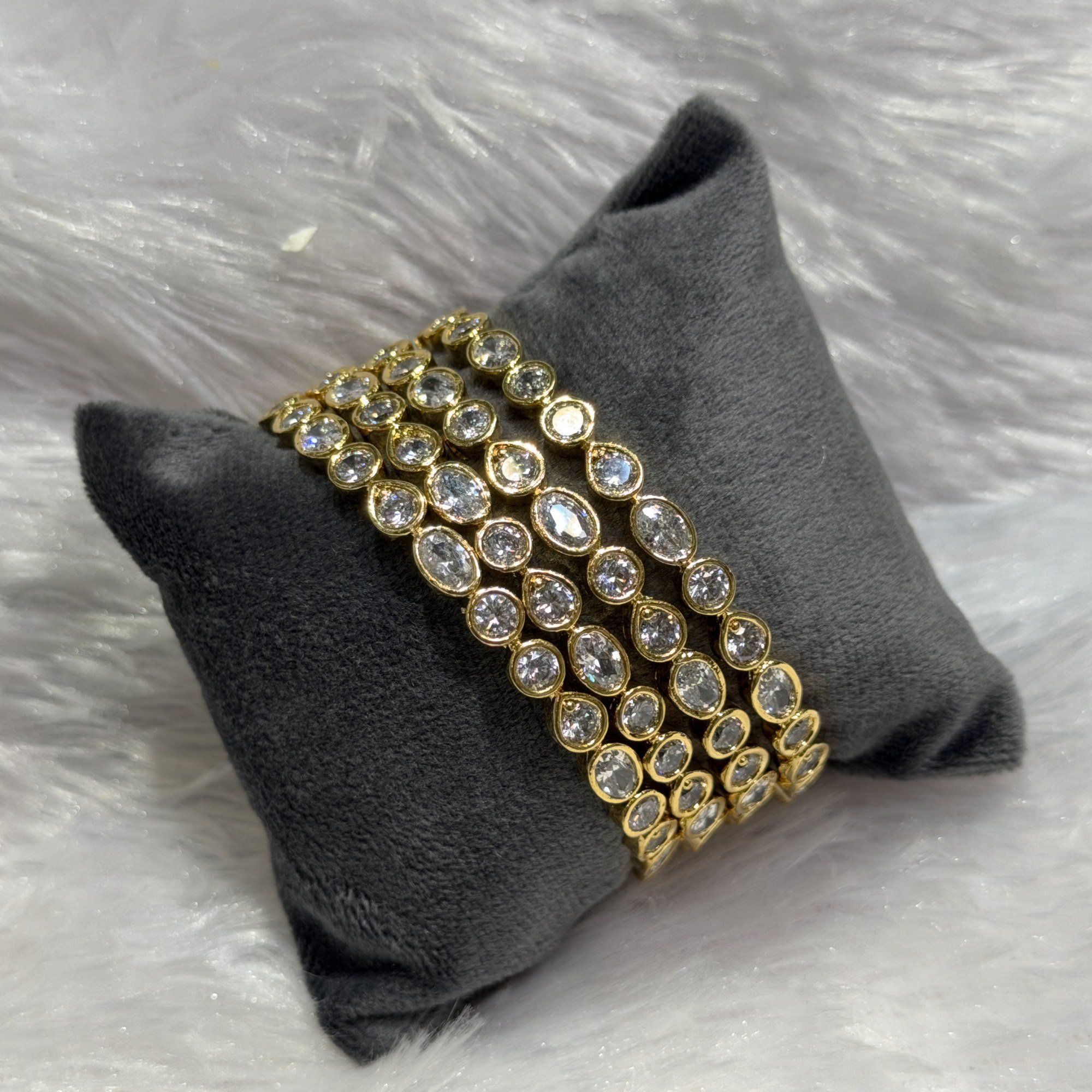 Oval stone layered bangles
