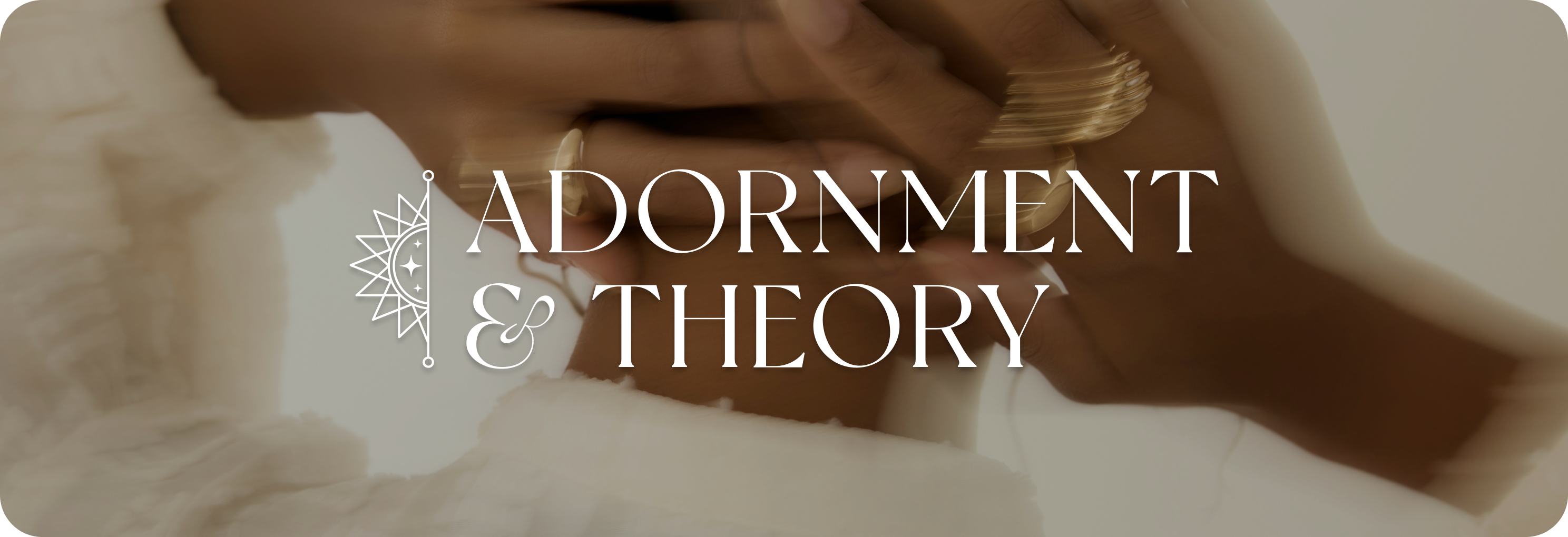 A woman adorned in jewelry with the Adornment & Theory logo