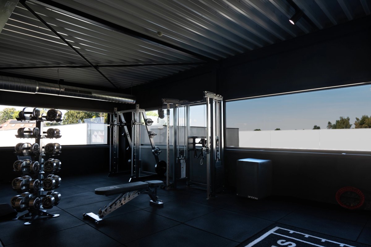 Gym with dumbbells and smith machine