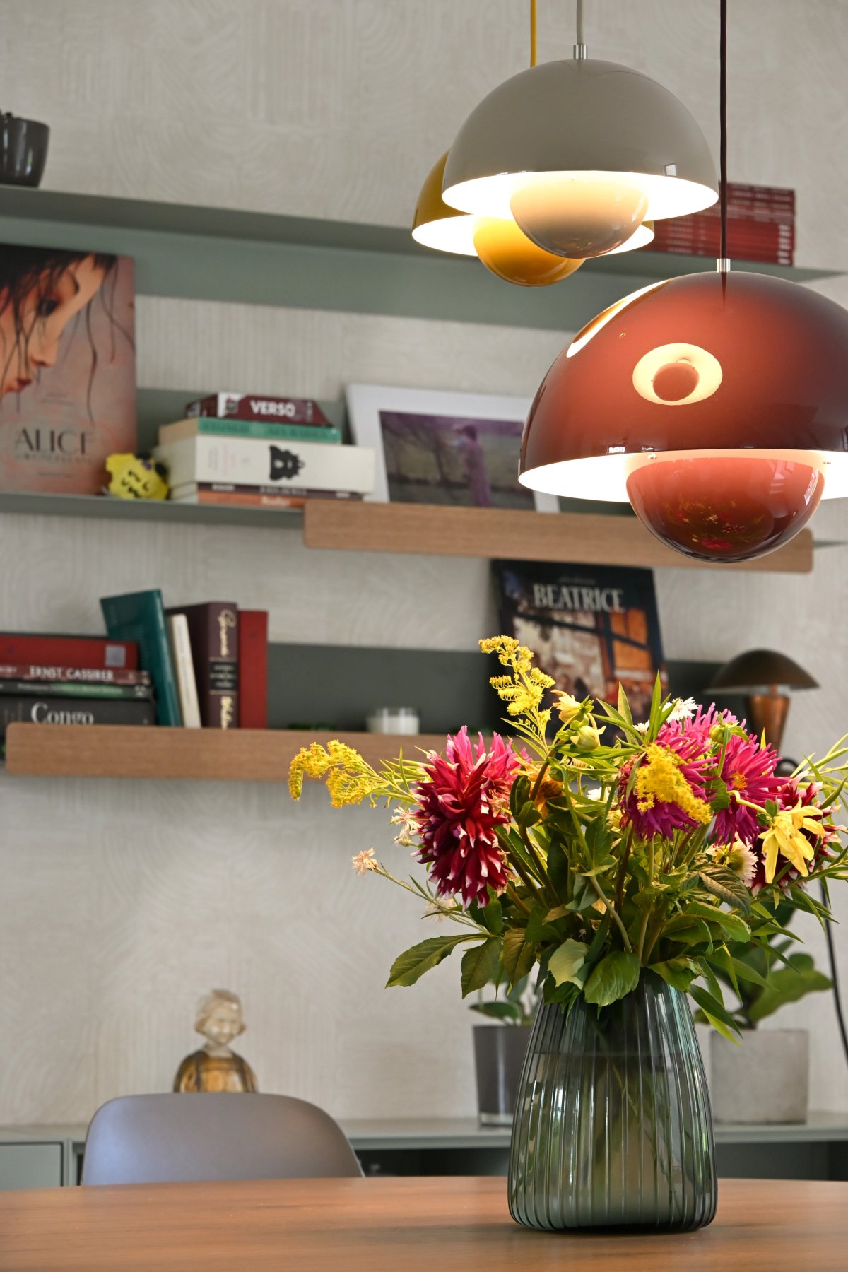 Vase of flowers illuminated by lamps