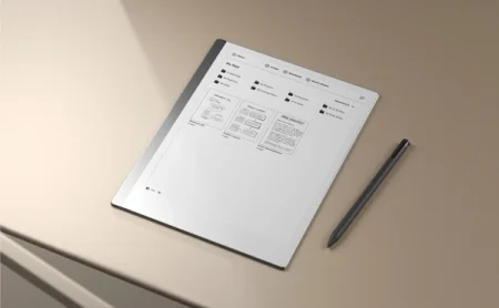 A reMarkable paper tablet displaying file organization, with a Marker to the right.