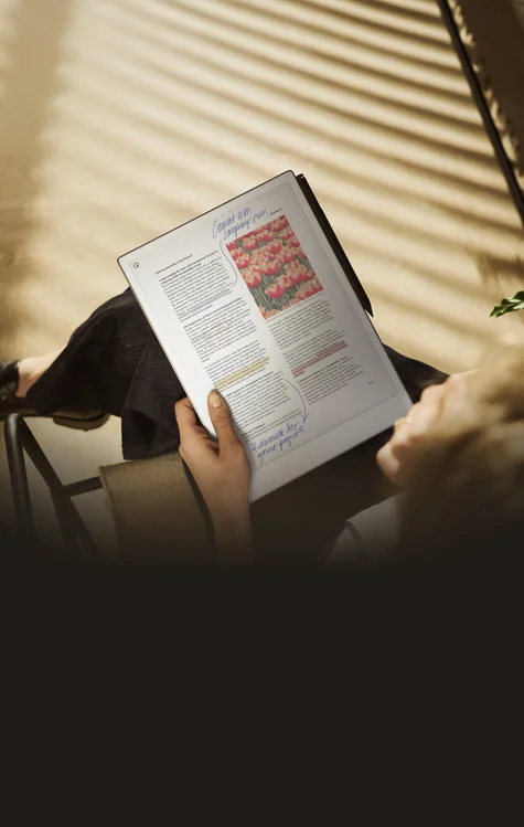 A person reviewing and annotating a document on a reMarkable Paper Pro.