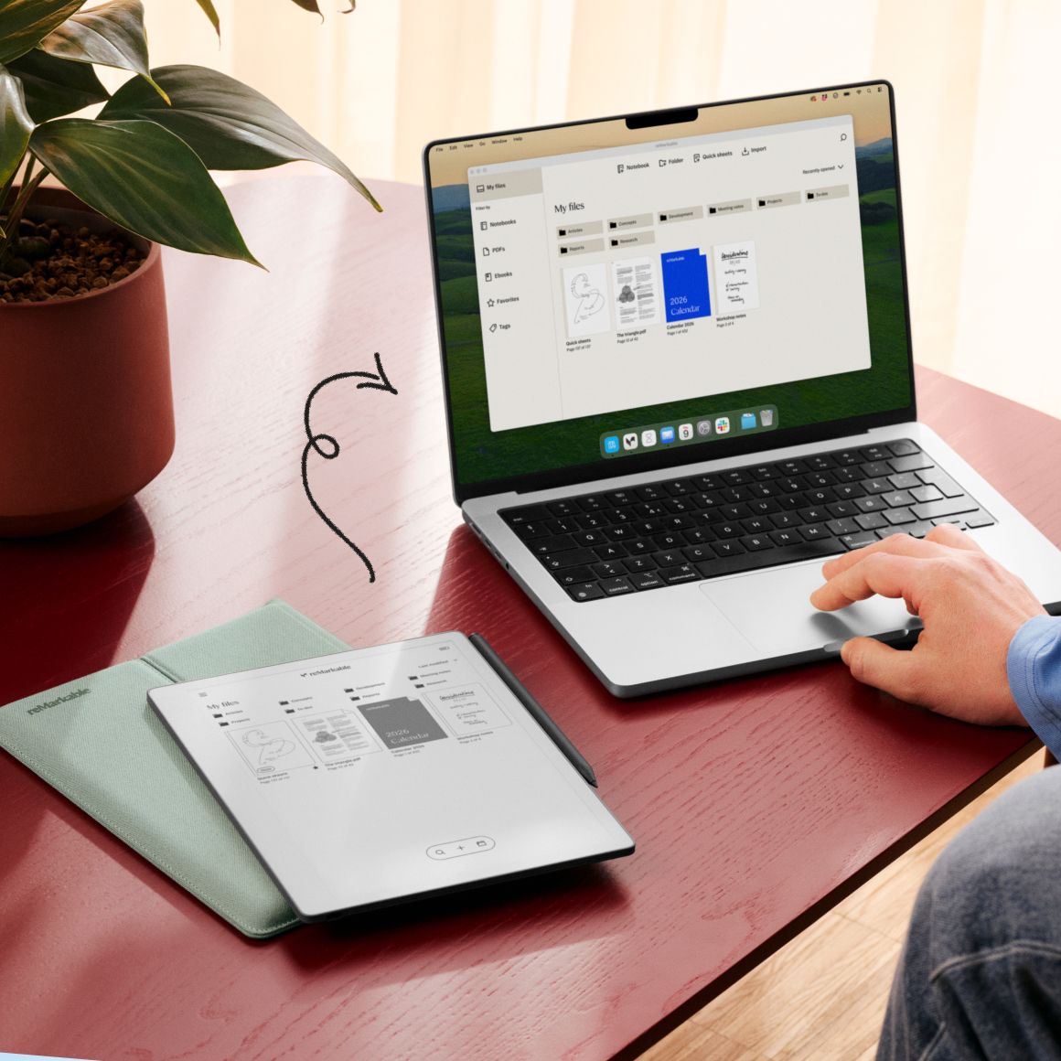 reMarkable Paper Pure side by side with a laptop computer, showing the same screen content of folder structure