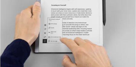 A reMarkable paper tablet displaying a menu with a document and settings visible on screen.