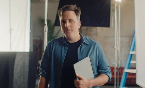 A man holding a reMarkable paper tablet.