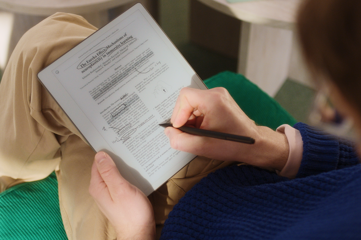 A man annotating on a document on his reMarkable Paper Pure tablet.